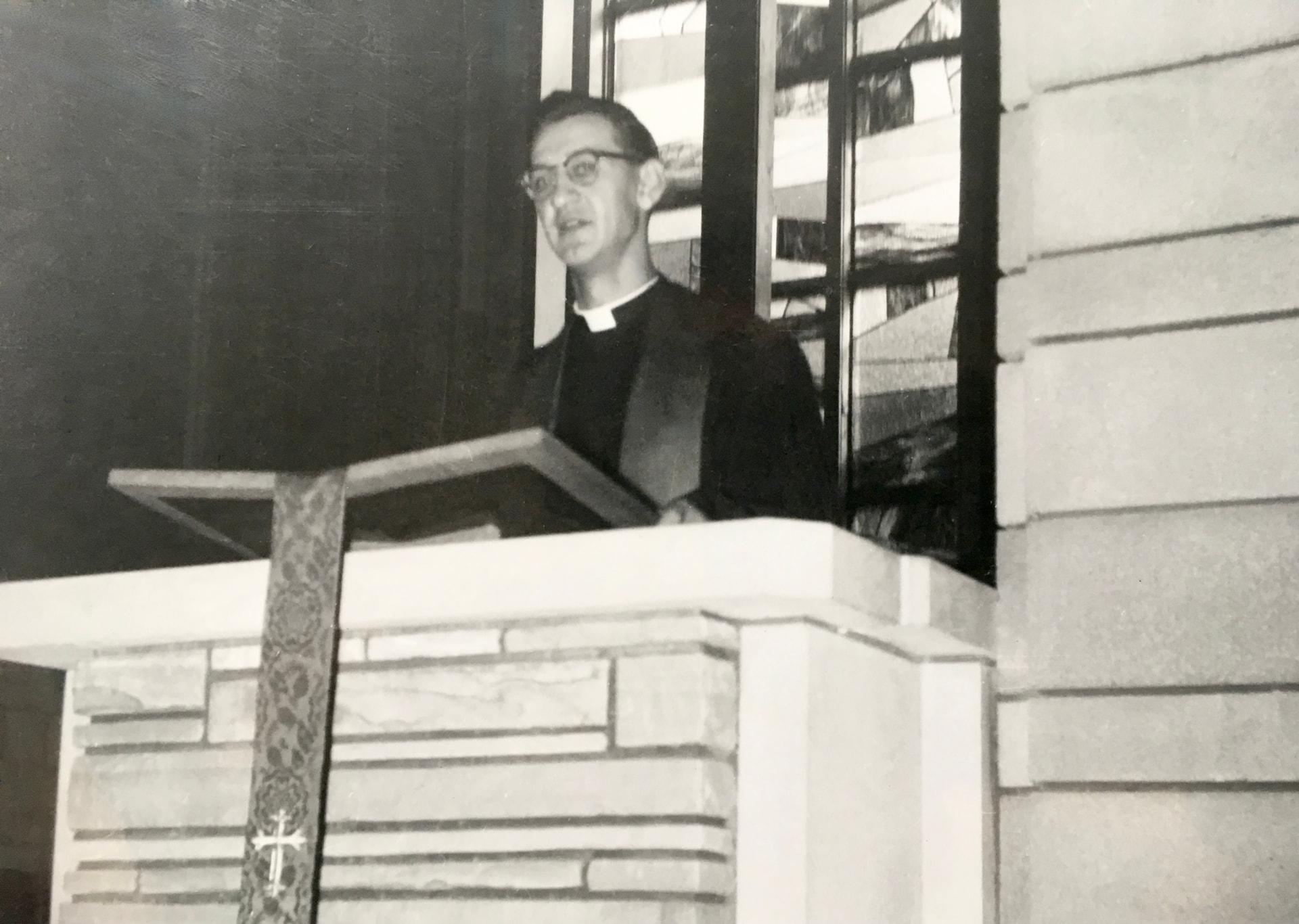 Rev. Leonard Ristow, Jr. preaching from the pulpit