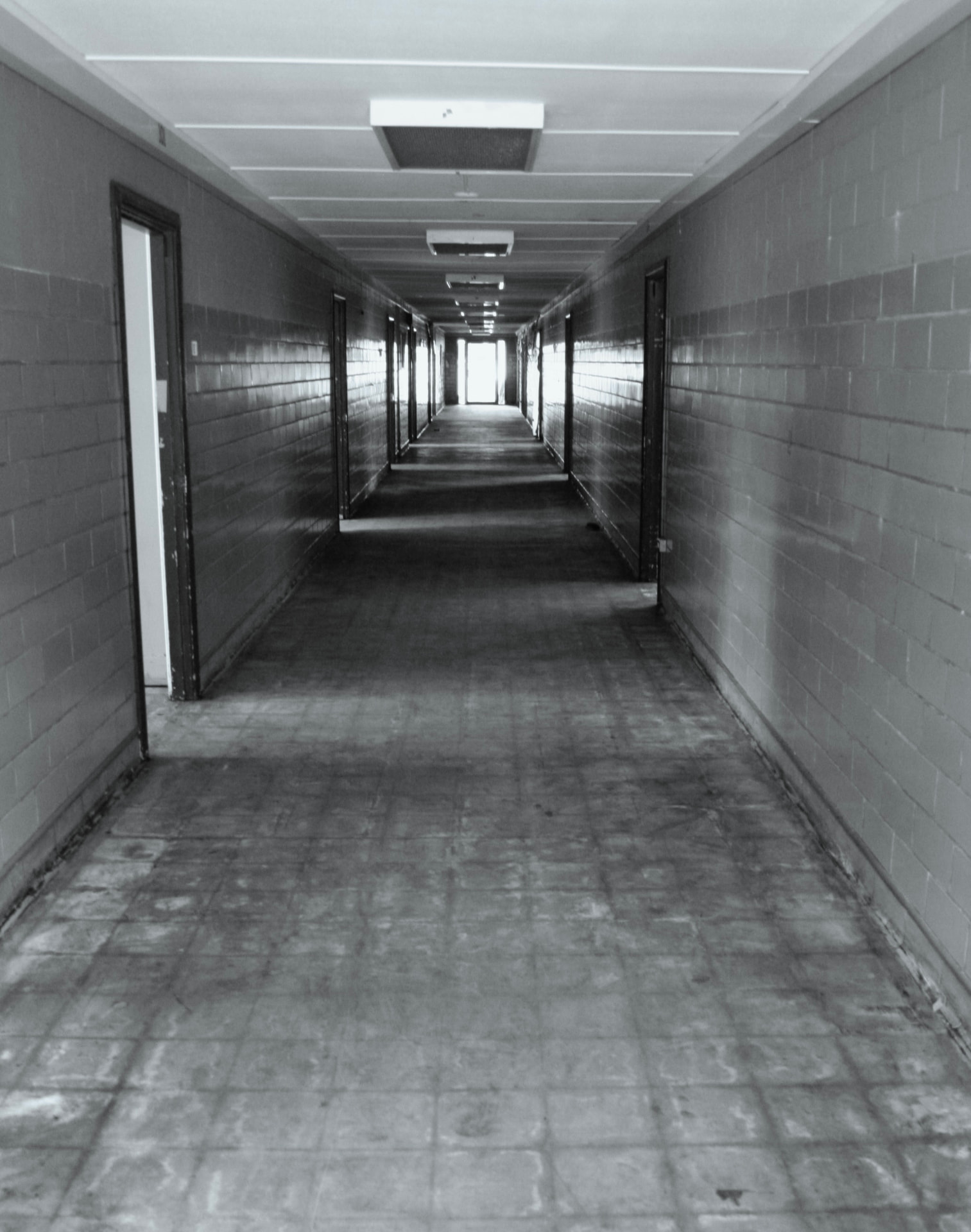 Long, empty hallway inside a campus building