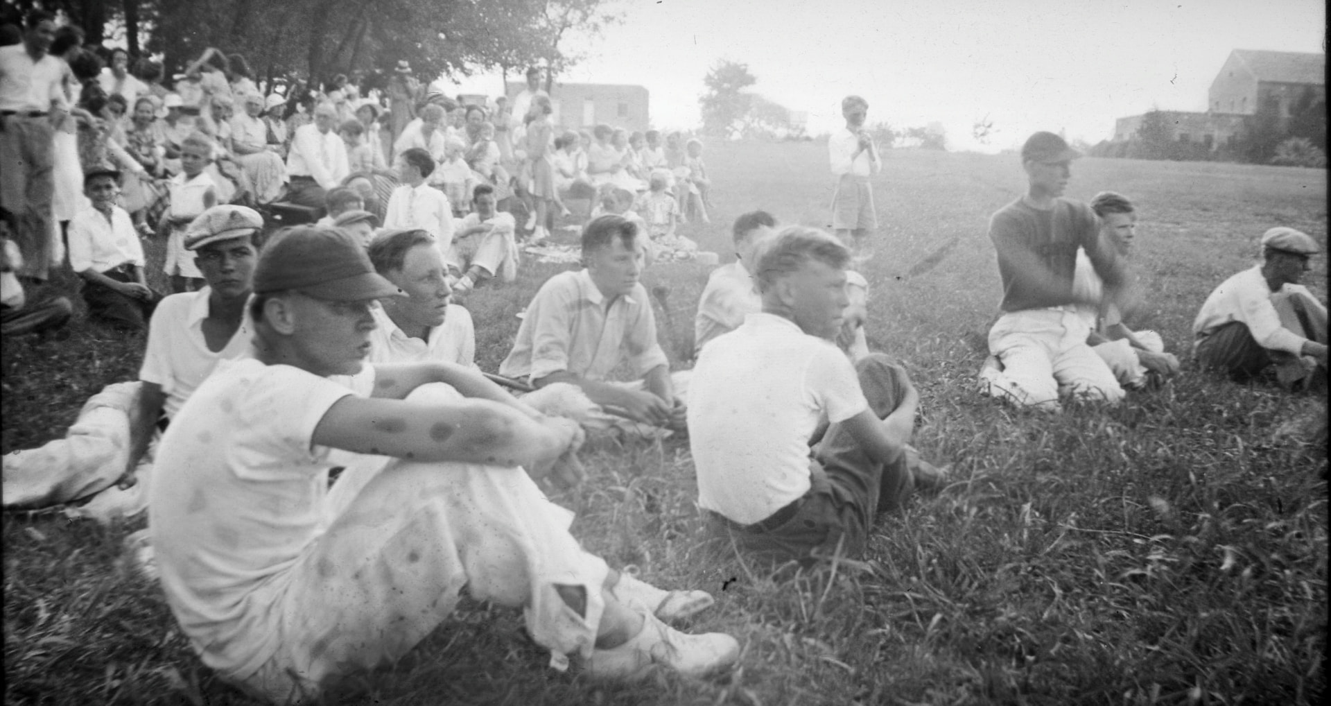 An archival black-and-white photo of a crowd gathered on Concordia’s lawn