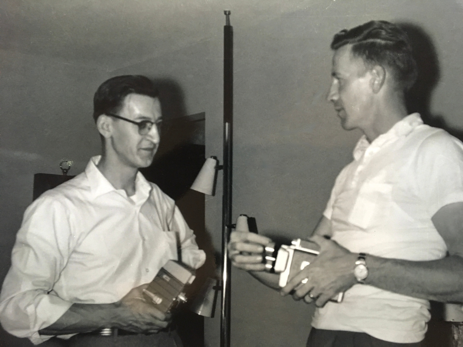 Leonard Ristow, Jr. (left) with his Bell & Howell 8mm film camera